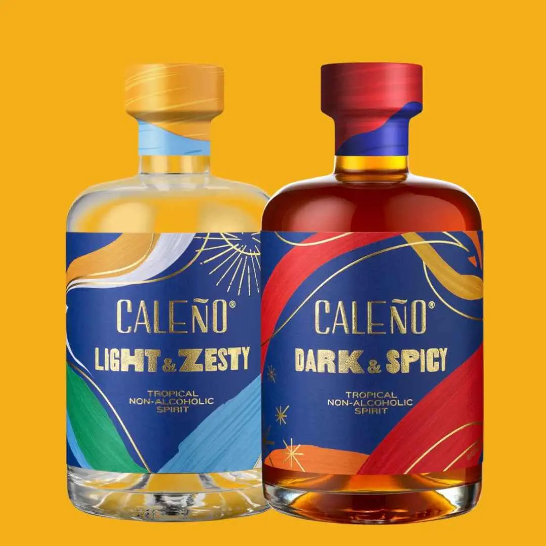 Two bottles of non alcoholic spirit on a yellow background