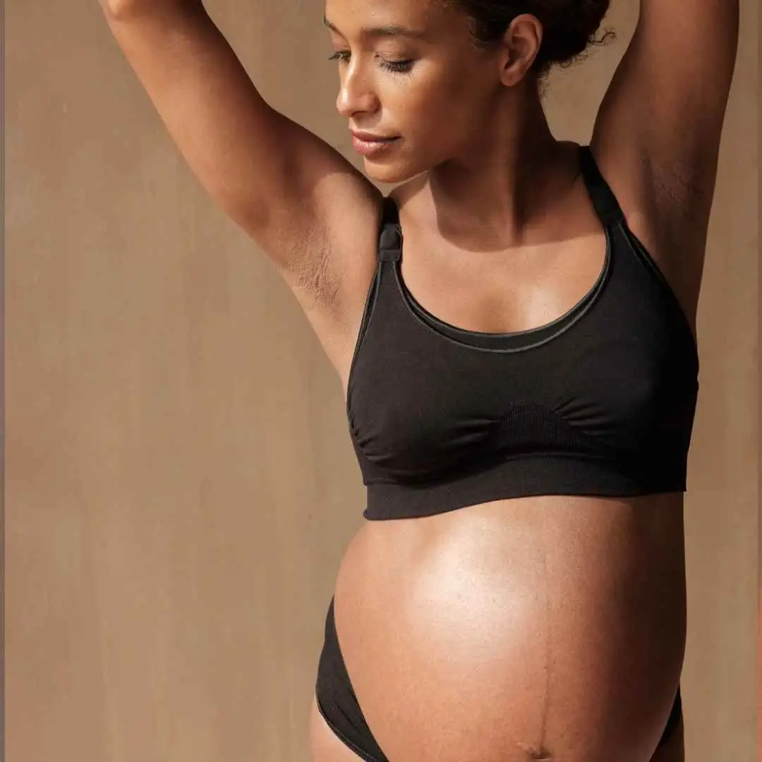 Pregnant mum-to-be wearing black nursing bra